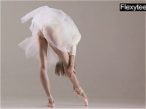 platinum-blonde gymnast performs gymnastics
